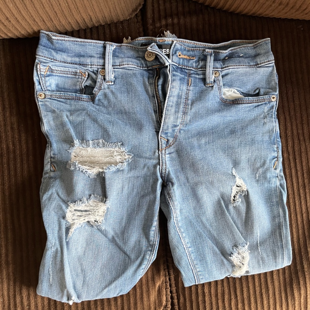 Express ripped up skinny jeans